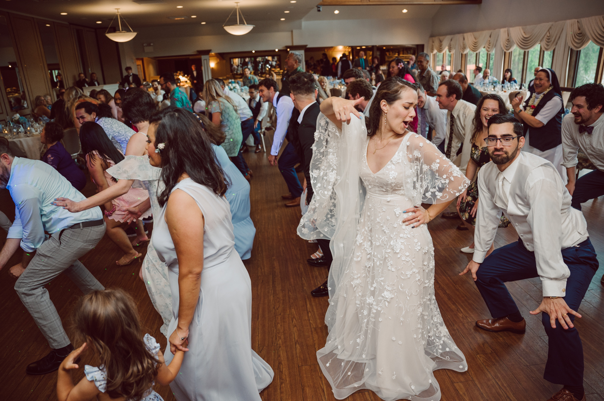 These two dancers, passionate lovers got married on a hot humid day at Auletto Caterers in Deptford NJ. Even though it was hot & humid Nina and Hector were all smiles as well as their family during the family portrait time. Wedding couple's and families that listens to you and does everything you ask them to even though the weather and environment can be tough are the BEST kind of clients! Nina and Hector were that best ideal clients, they from day one left all control regarding photo to me, did not question or have concerns. Knowing that you have this full trust and control on the wedding day makes you want to give your 100% and more. Nina and Hector are one of my top ideal clients and their wedding day photos are living proof of it. Nina and Hector's wedding day was combined of casual, mess, chaos, laughters, chill, emotional and passionate love for dancing. This was my first time at Auletto Caterers and in this part of NJ and this wedding venue in Deptford NJ was a pleasant surprise. It was full of secret locations for photos, garden, little pond where I played around with reflections, peacocks, waterfall and lavender field! Plus kind people to work with. Nina and Hector's July wedding at Auletto Caterers NJ captured by Karis from Hey Karis NY, NJ, Brooklyn, Hudson Valley and Catskills Wedding and Elopement Photographer.